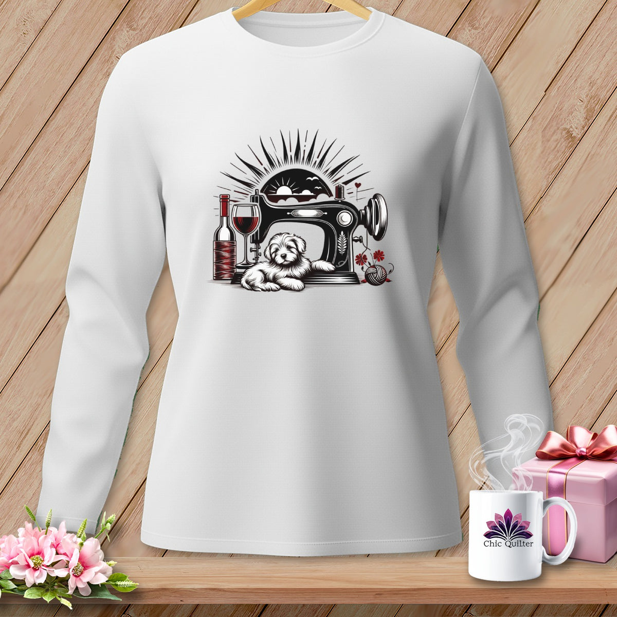 White long-sleeve shirt with a graphic of a dog by a sewing machine, wine, and yarn.