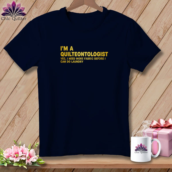 Navy t-shirt with "I'm a Quilteontologist" text and a logo.