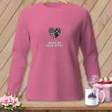 Pink long-sleeve shirt with a patchwork heart graphic and text 