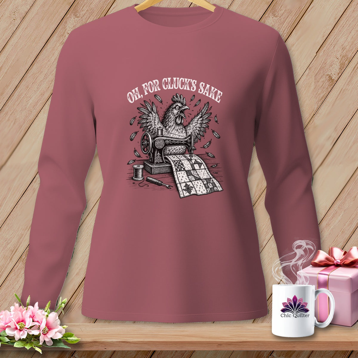 T-shirt with distressed illustration of a chicken sewing a quilt, saying "Oh, for cluck's sake".