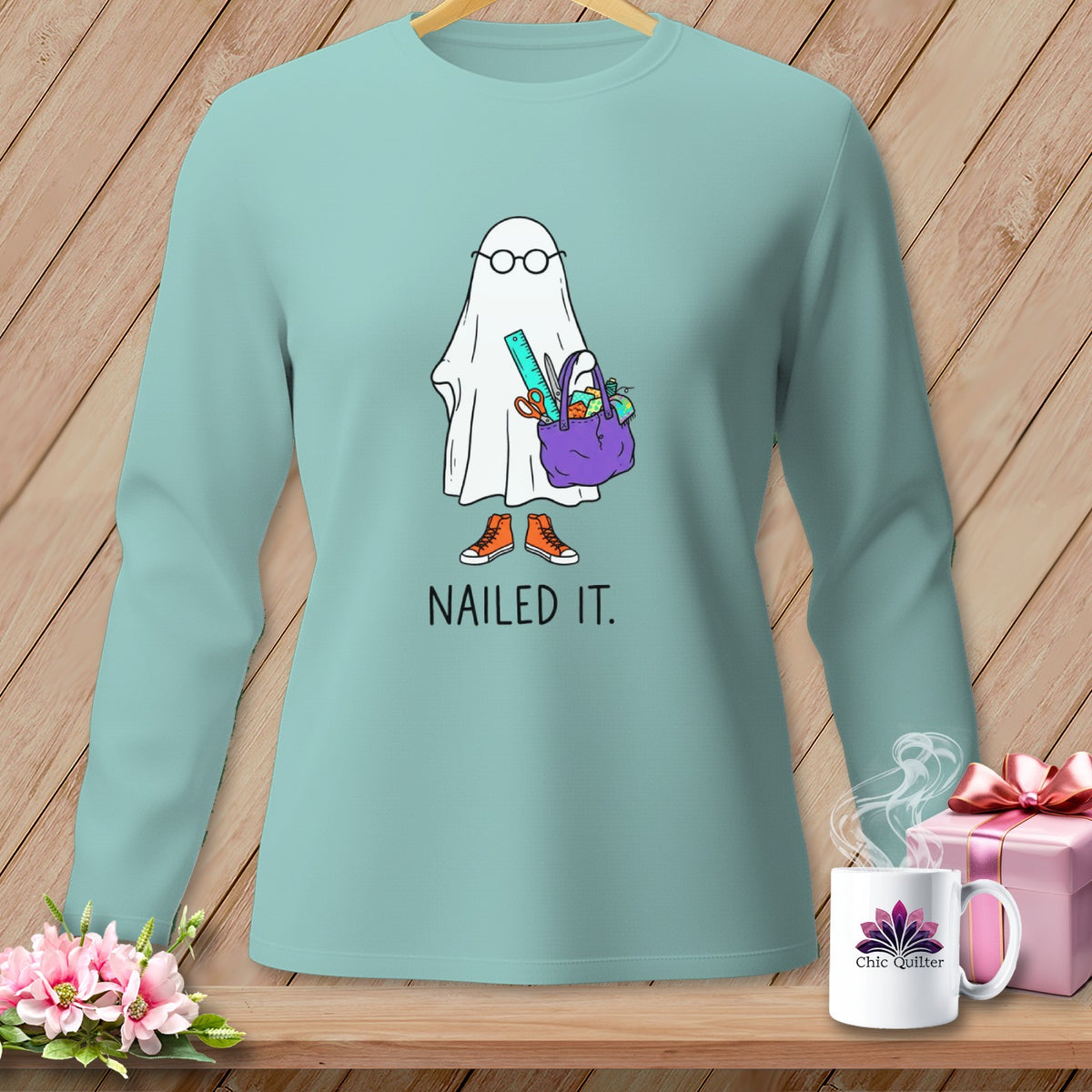 Ghost with glasses, scissors, ruler, and supplies in a bag, with "Nailed It." text.