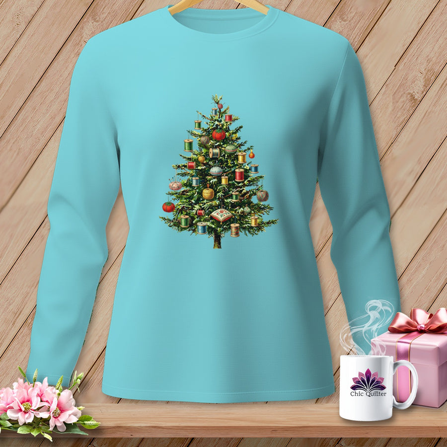 Teal long-sleeve shirt with a Christmas tree adorned with spools of thread.
