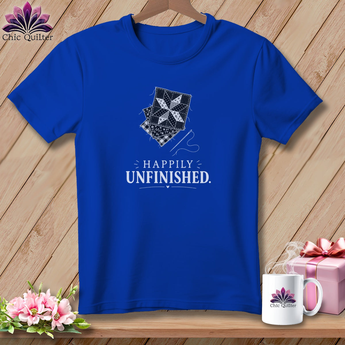 Royal blue t-shirt with quilting blocks and "Happily Unfinished" text.