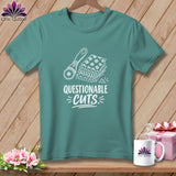Teal t-shirt with rotary cutter, fabric stack, and text 