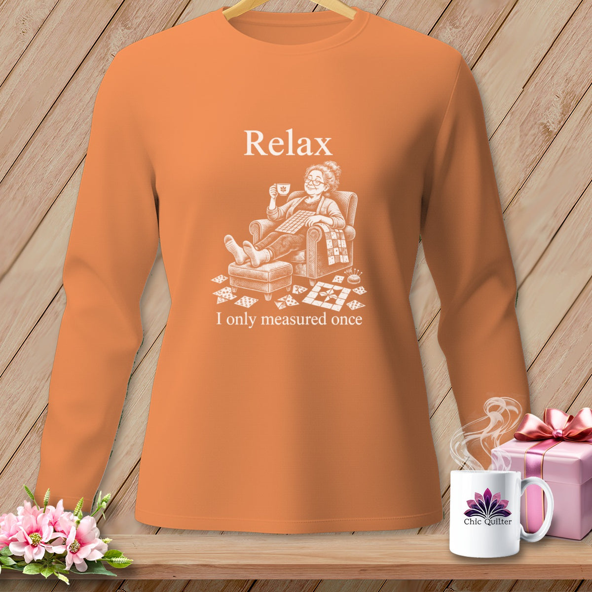 Orange long-sleeve shirt with "Relax, I only measured once" graphic.