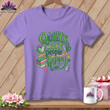 Purple t-shirt featuring the green text Quilts Make People Happy, surrounded by sewing-themed illustrations.