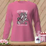 Long-sleeved pink shirt with raccoon holding rotary cutter, and text 