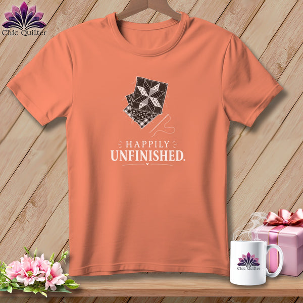 Orange t-shirt with quilting block graphic and "Happily Unfinished" text.
