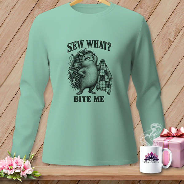 Sage green long-sleeve t-shirt with a graphic of a hedgehog holding a quilt and text reading Sew What Bite Me.