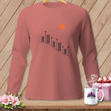 Long-sleeve rose shirt with spools of thread graphic and orange button.