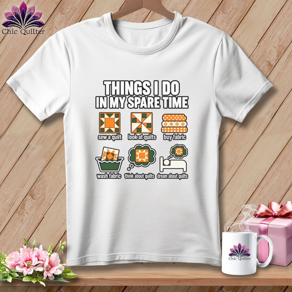 White t-shirt featuring a quilting graphic and text listing six spare-time activities, displayed on a wooden surface.