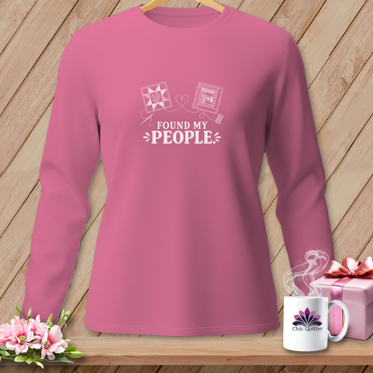Pink long-sleeve shirt with "Found My People" and quilting graphics.