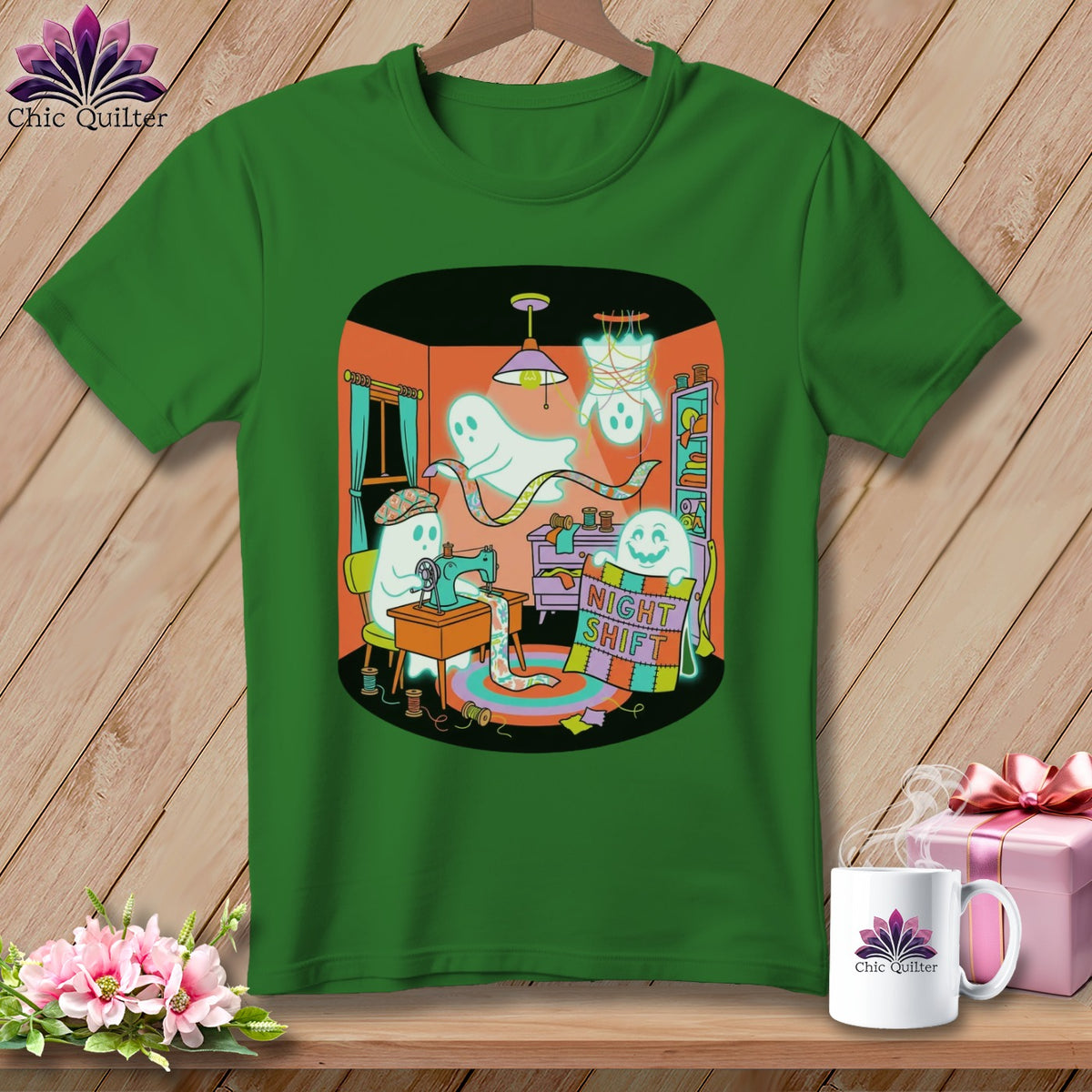 Green t-shirt with ghosts sewing a quilt that says "Night Shift".