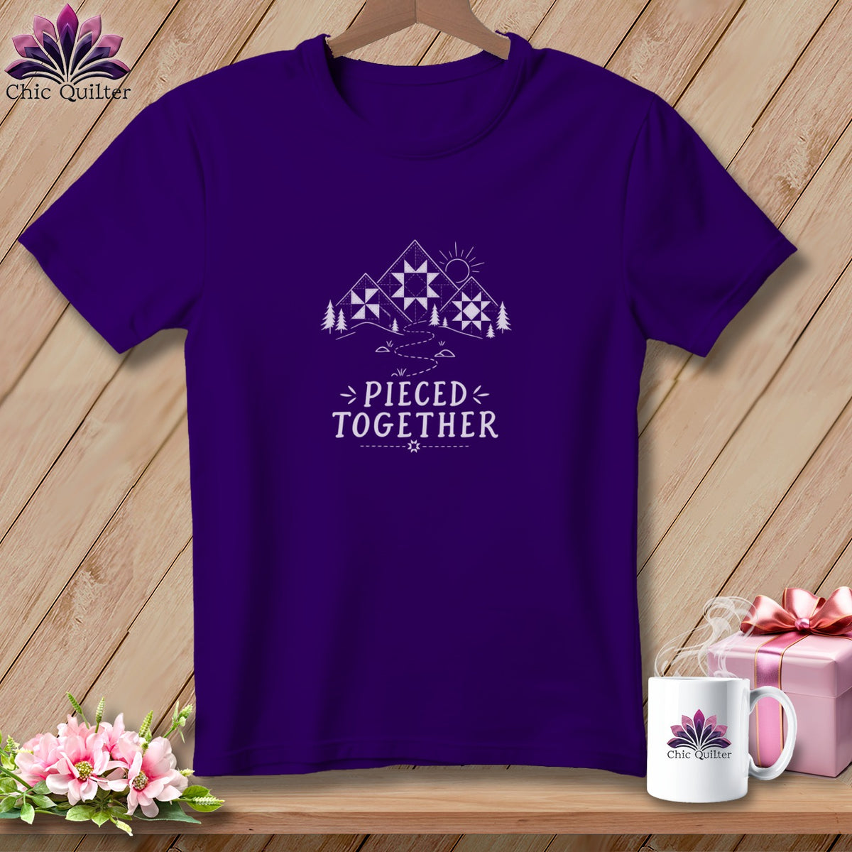 Purple t-shirt with "Pieced Together" text and mountain quilt graphic.