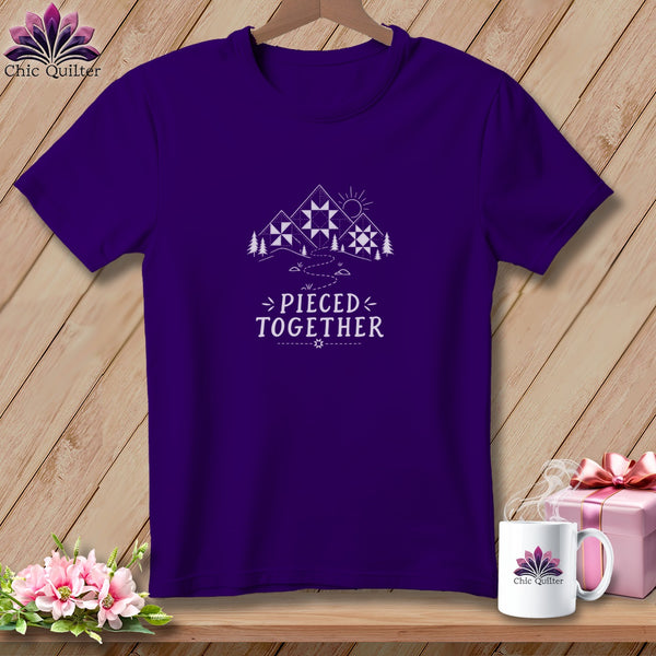 Purple t-shirt with "Pieced Together" text and mountain quilt graphic.