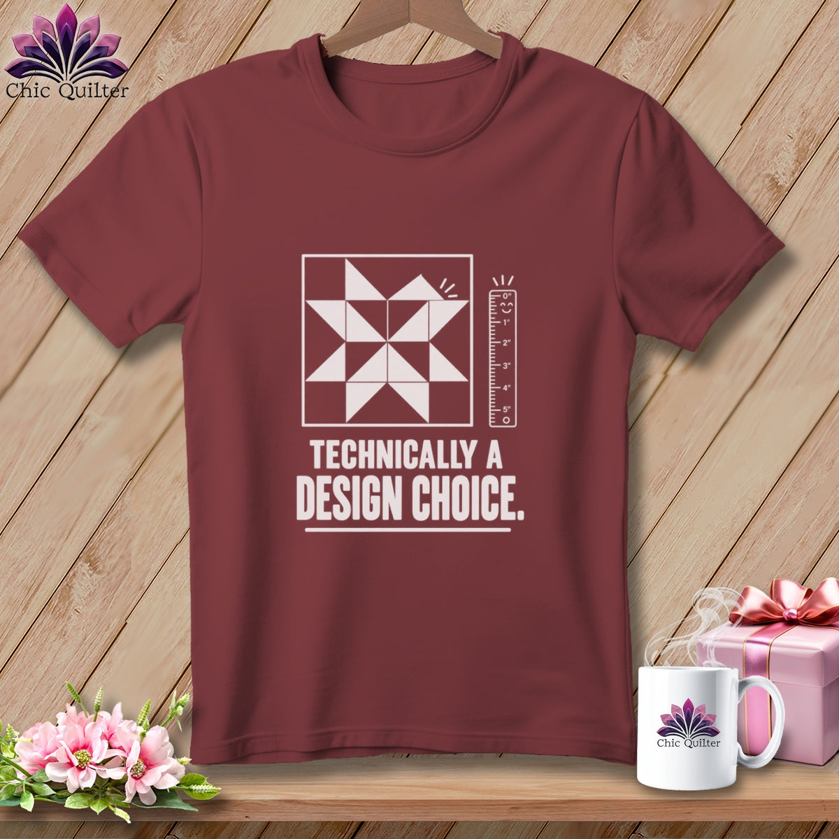 Maroon t-shirt with quilting block graphic and text "Technically a design choice."