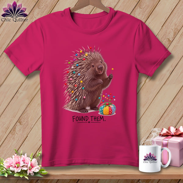 Porcupine with pins in quills, and text "FOUND THEM."