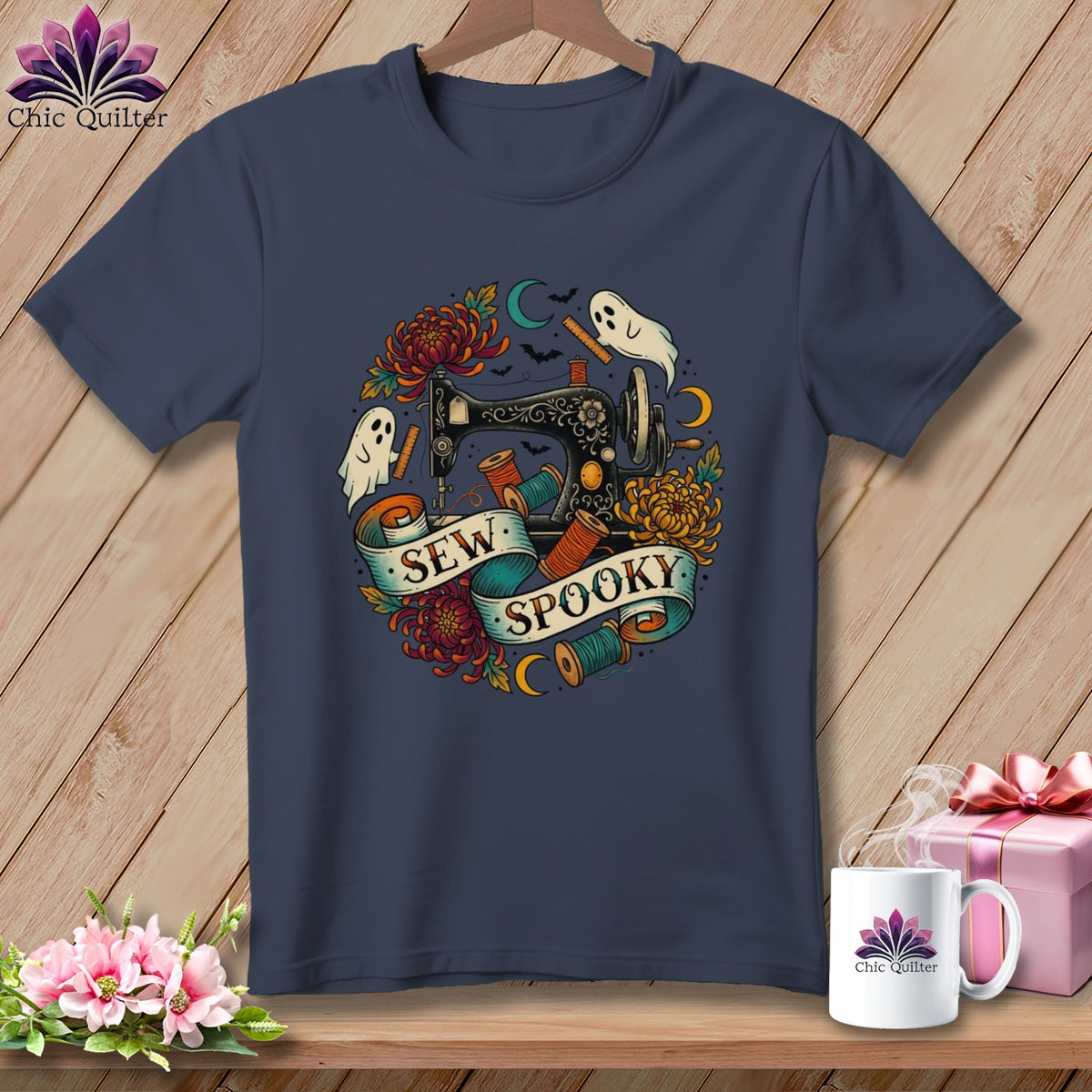 Dark blue t-shirt with "Sew Spooky" text, sewing machine, ghosts, and flowers graphic.