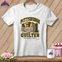 A white short-sleeve t-shirt features a Pittsburgh quilter graphic with fabric rolls and text.