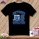 A black t-shirt features blue text reading DETROIT QUILTER STITCH SIX, a quilt block, and the number six.