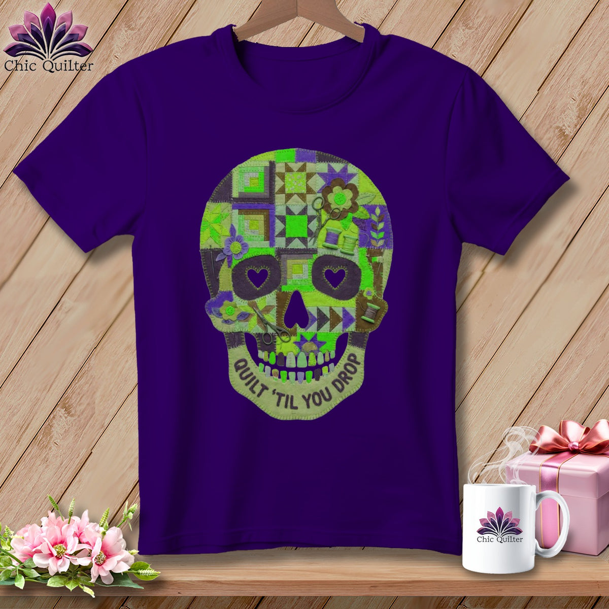 Purple t-shirt with a quilted skull graphic that reads "Quilt 'til you drop".