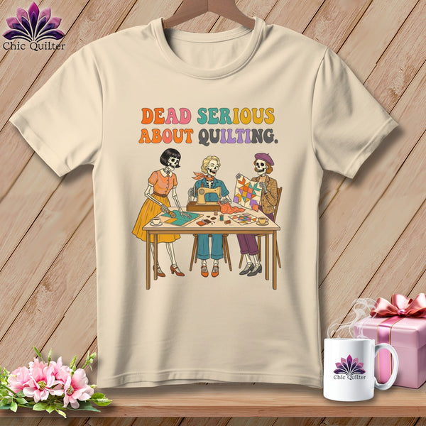 T-shirt graphic with three skeletons sewing and quilting, reading "Dead Serious About Quilting."