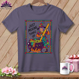 Purple t-shirt with a witch stirring a cauldron, reads 