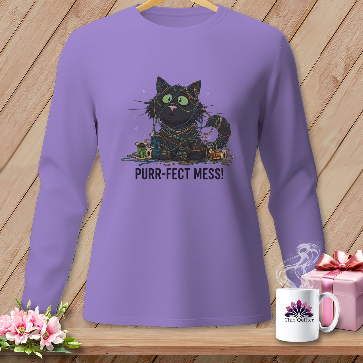 Purple long-sleeve shirt with a black cat tangled in yarn and the text "PURR-FECT MESS!".