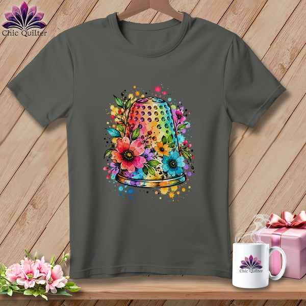 Charcoal gray t-shirt featuring a colorful watercolor design of a thimble surrounded by flowers.