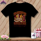 A black t-shirt featuring a graphic with a crate of fabric bolts and Washington Quilter text.