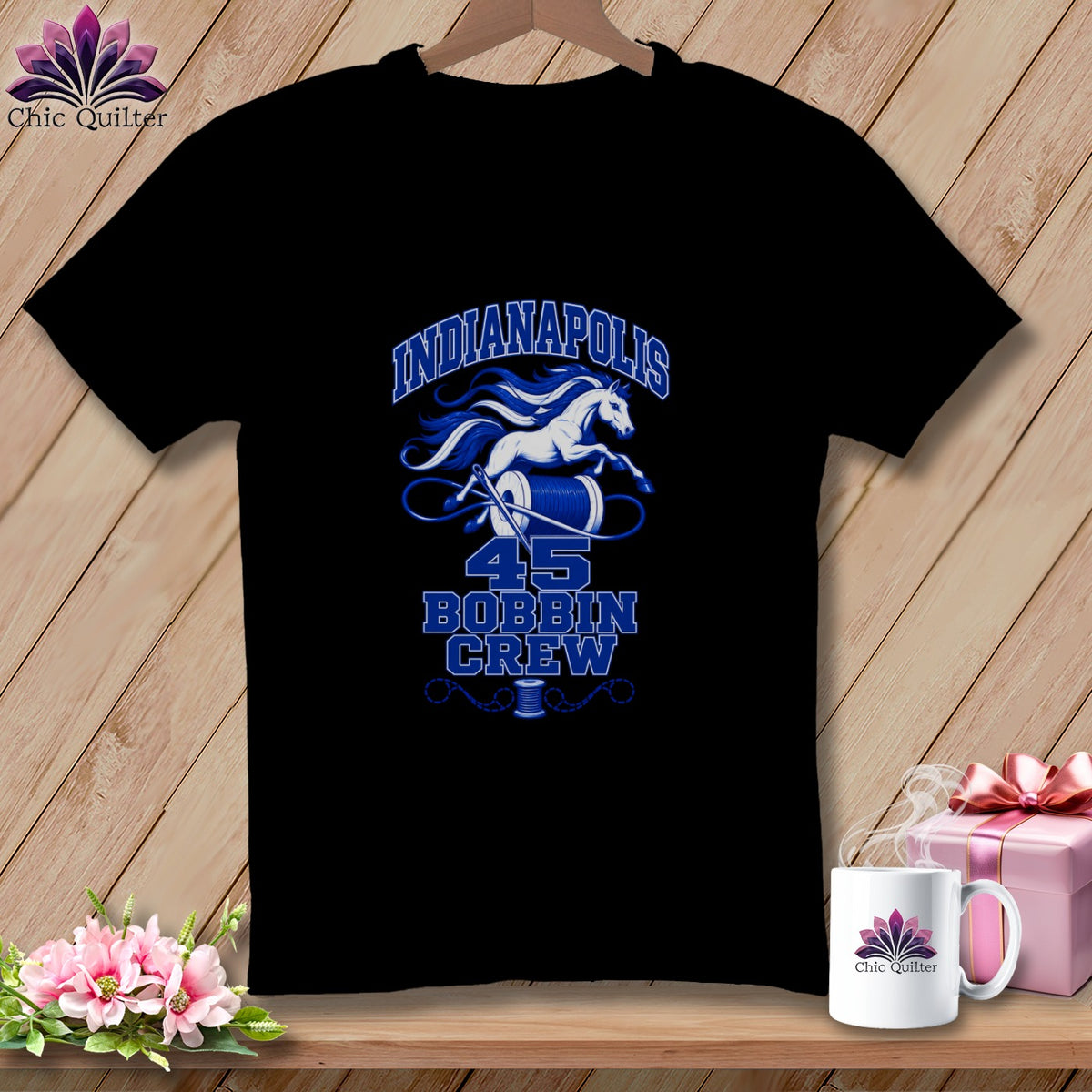 Black t-shirt featuring a blue and white graphic with a running horse, sewing thread, and text that reads Indianapolis 45 Bobbin Crew.