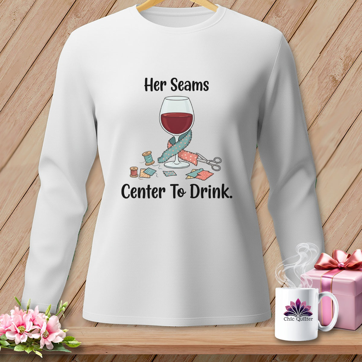 White long-sleeve shirt with "Her Seams Center To Drink" graphic.
