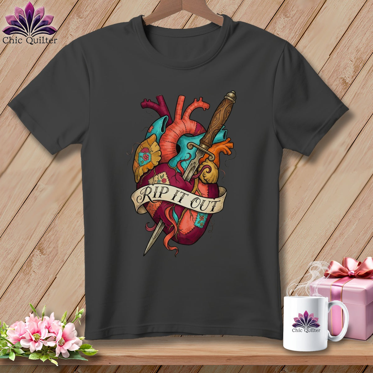 Dark grey t-shirt with colorful anatomical heart graphic and banner saying "RIP IT OUT."