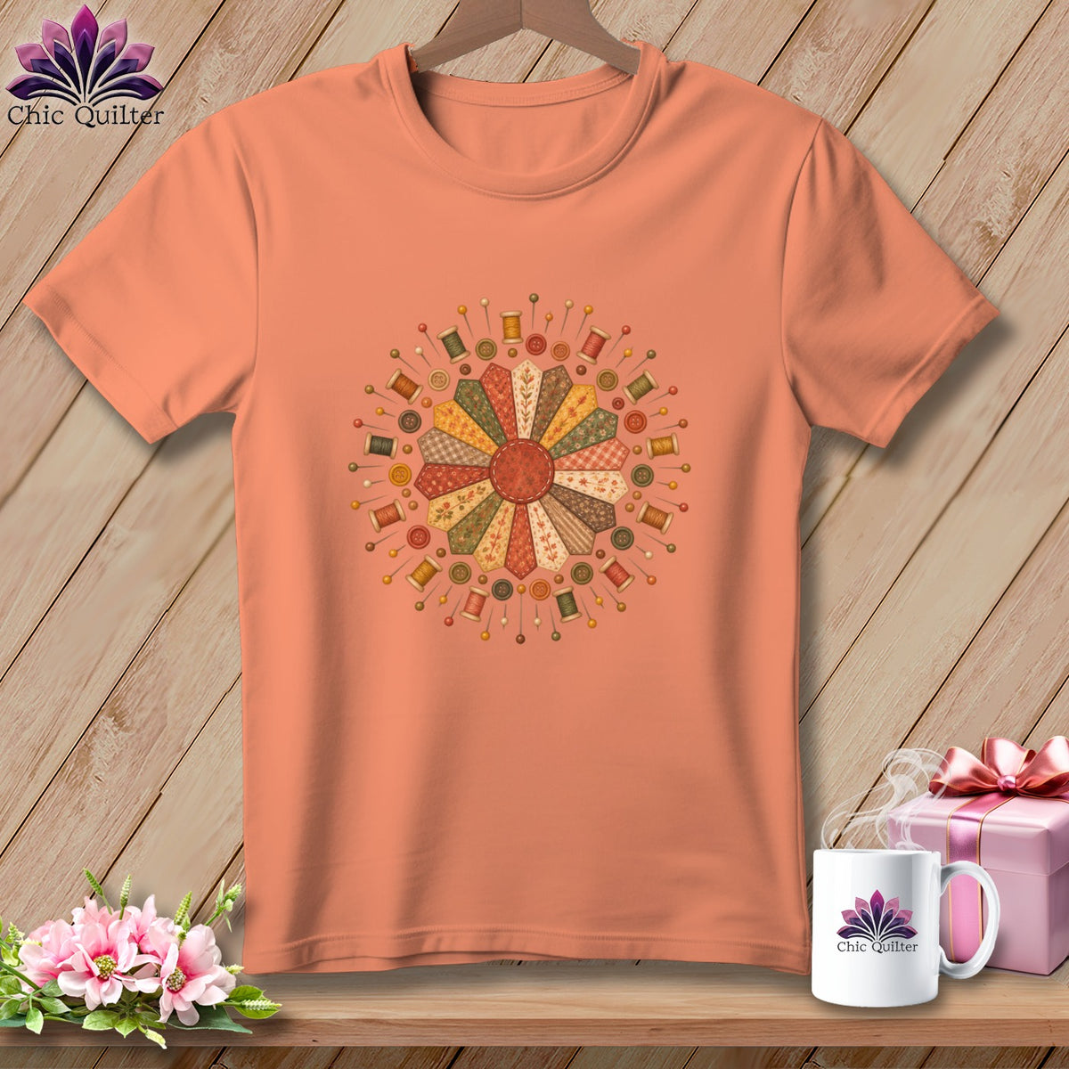 Peach t-shirt with a circular quilt design featuring spools of thread and buttons.