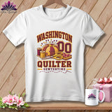 White t-shirt featuring a quilting graphic with text reading Washington Quilter and a pincushion, scissors, and spools.
