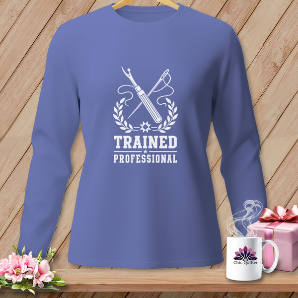 Blue long-sleeve shirt with "Trained Professional" sewing graphic and Chic Quilter mug.