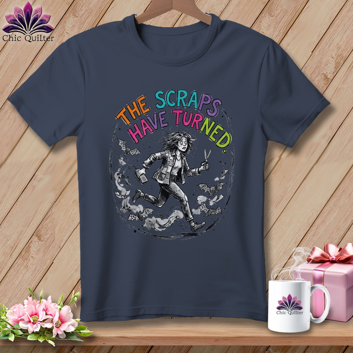 Dark blue t-shirt with text "The Scraps Have Turned" and a running figure.