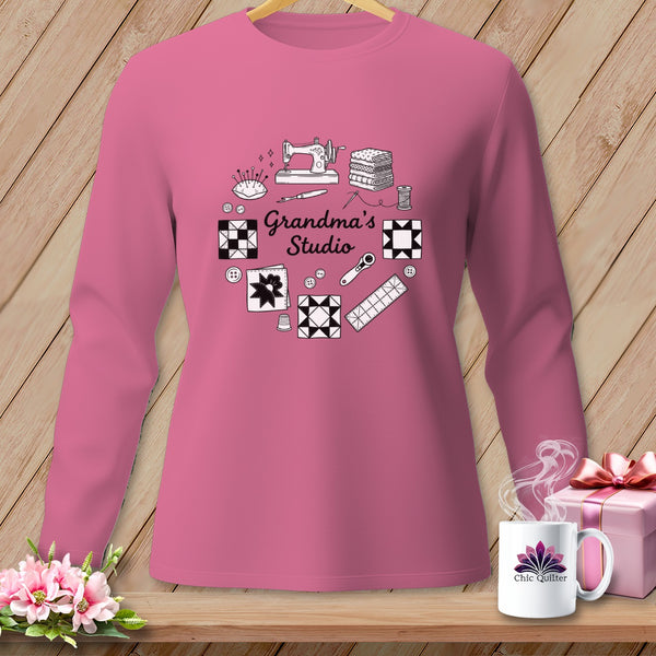 Pink long-sleeve shirt with "Grandma's Studio" text and quilting graphics.