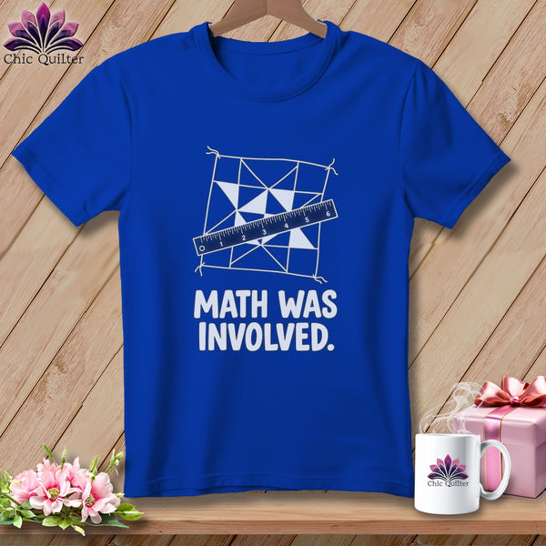 Blue t-shirt with a white quilt pattern, ruler, and text "MATH WAS INVOLVED."