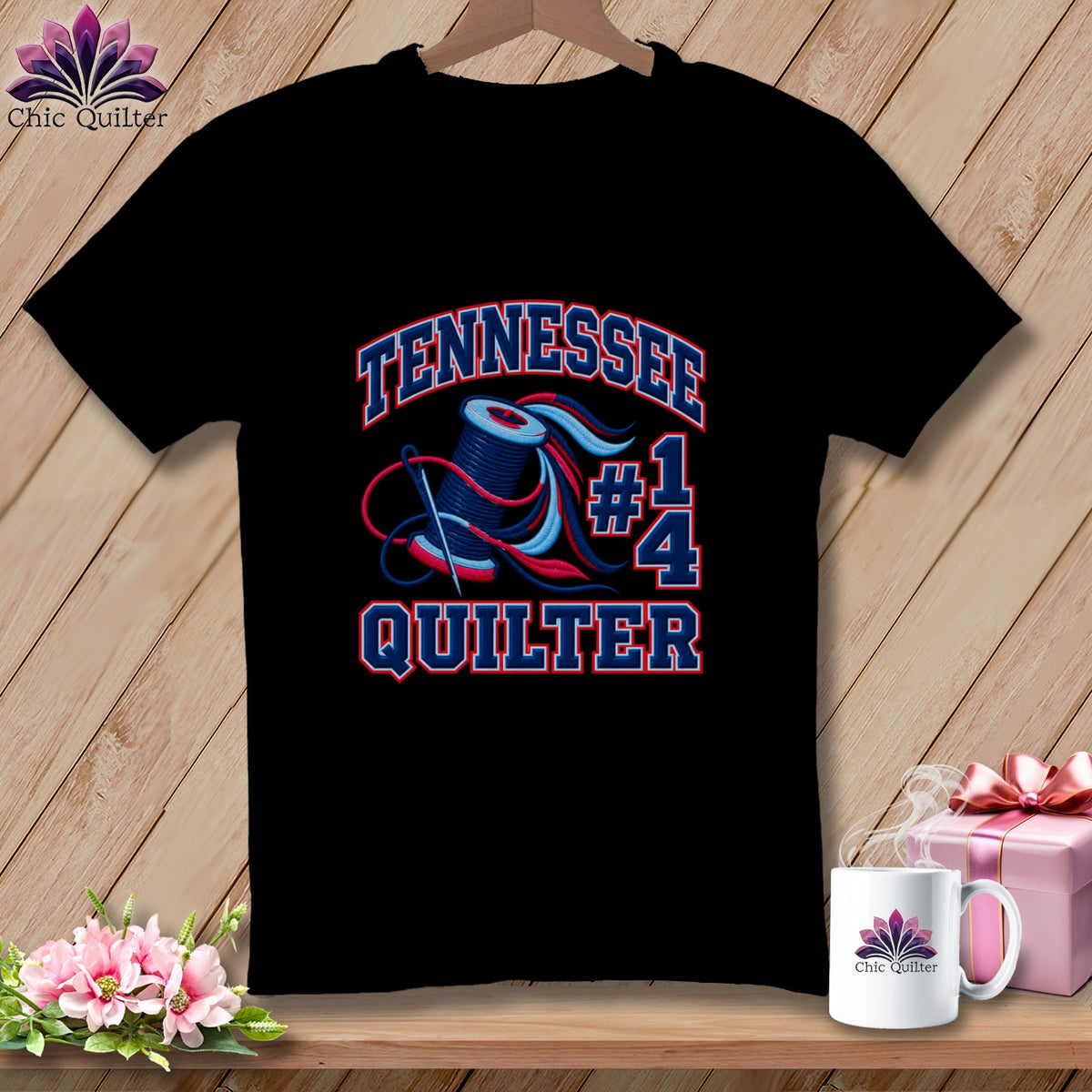 A black t-shirt featuring the text "TENNESSEE #1 QUILTER" with a spool of thread and needle graphic.