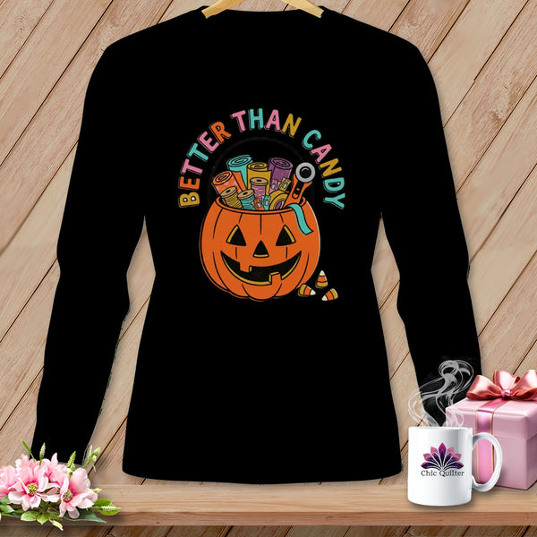 Black long-sleeve shirt with a pumpkin filled with sewing notions and text "Better Than Candy."