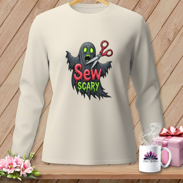 Long-sleeve shirt with ghost graphic and "Sew Scary" text, holding scissors.