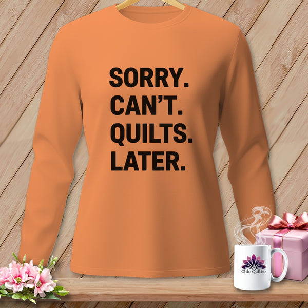 Orange long-sleeve shirt with "Sorry. Can't. Quilts. Later." text.