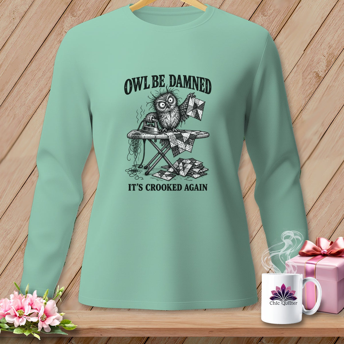 Long sleeve shirt with a distressed owl ironing quilted squares, text "Owl Be Damned It's Crooked Again".