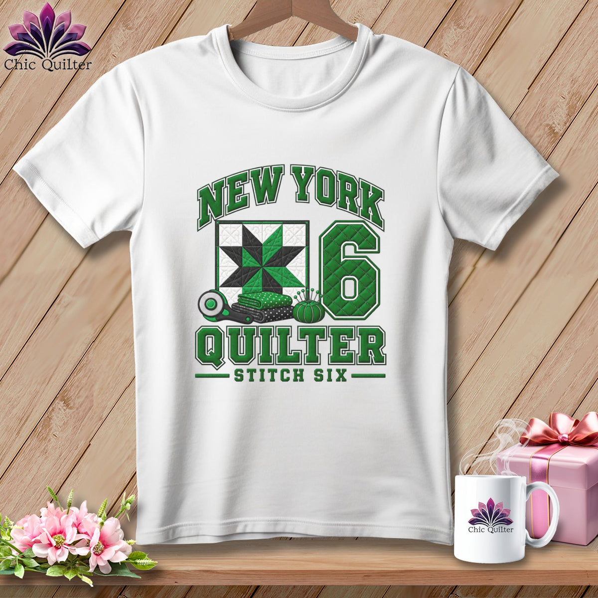 White t-shirt with a green New York Quilter graphic, a quilted square, and the number six.