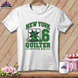 White t-shirt with a green New York Quilter graphic, a quilted square, and the number six.