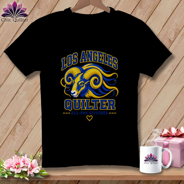 Black t-shirt featuring a blue and yellow ram graphic with text reading Los Angeles Quilter All-Pro Stitcher.