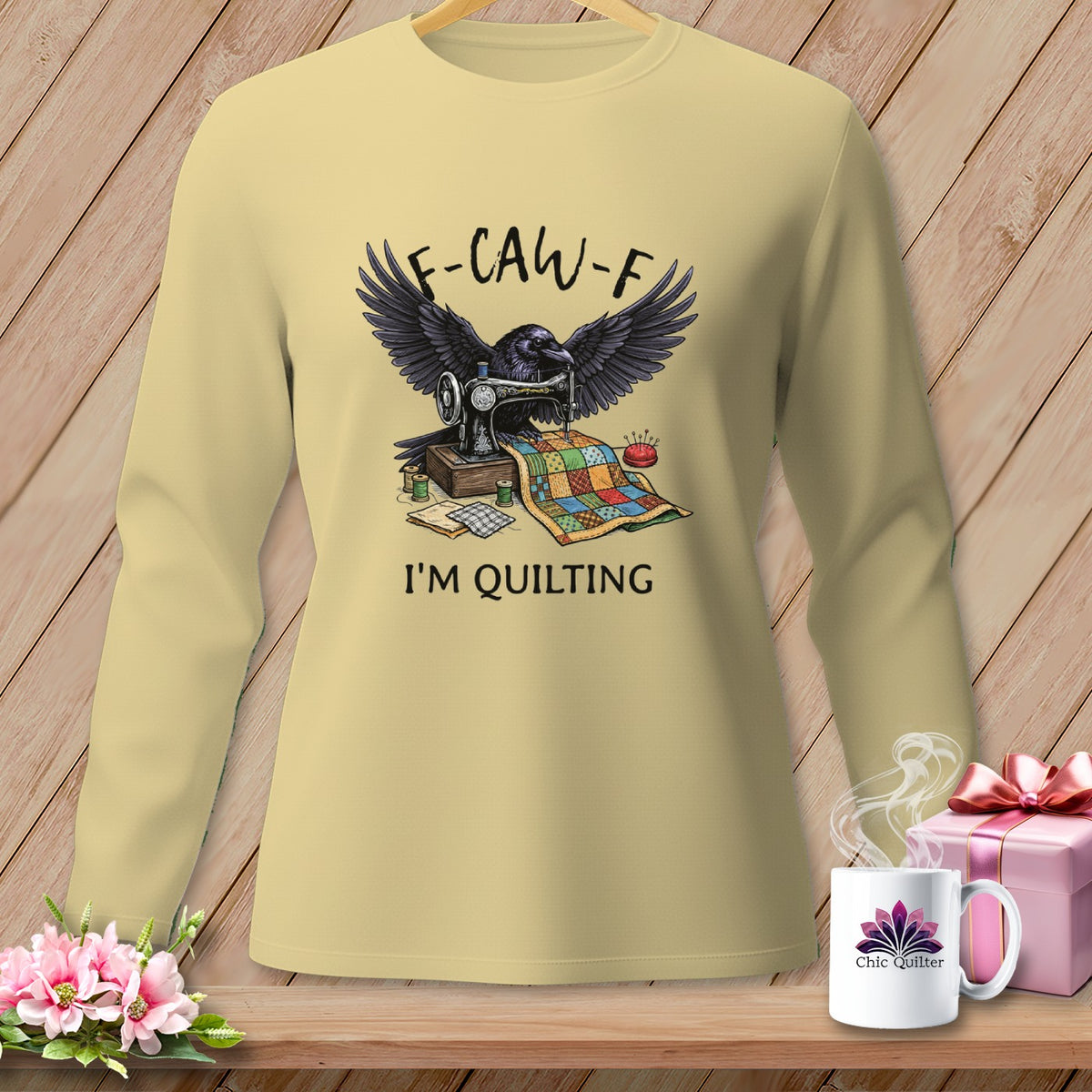 Raven sewing quilt with text "F-CAW-F I'M QUILTING" on a cream shirt.