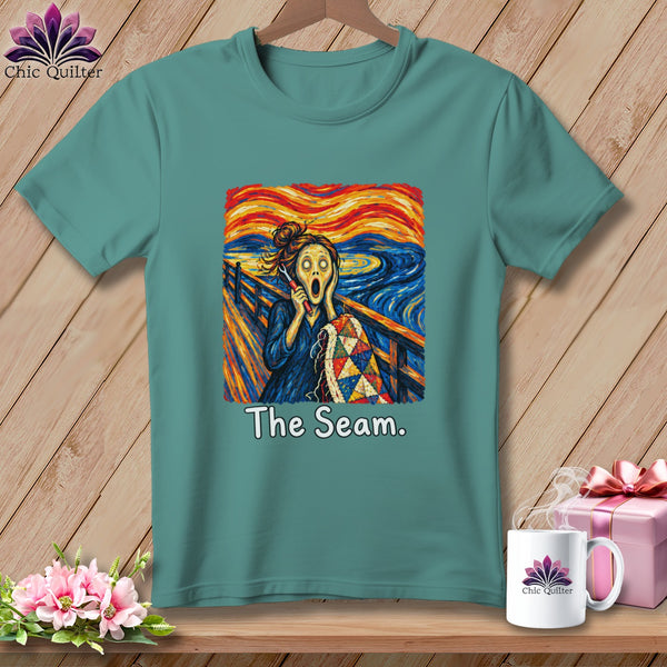 Teal t-shirt with "The Scream" parody featuring a quilter and the text "The Seam."
