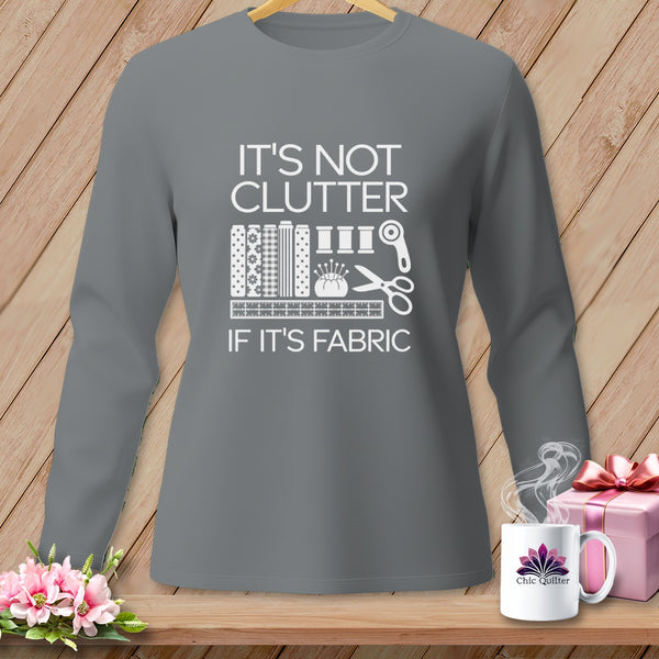 Gray long-sleeve shirt with white text and sewing graphics reading "It's Not Clutter If It's Fabric."
